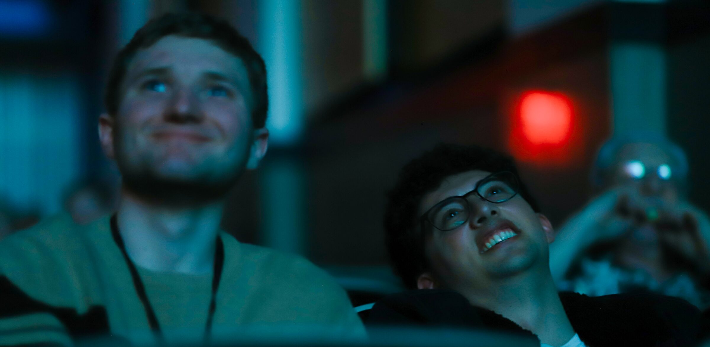 Audience members smiling during a screening at the Harris Theater in 2026