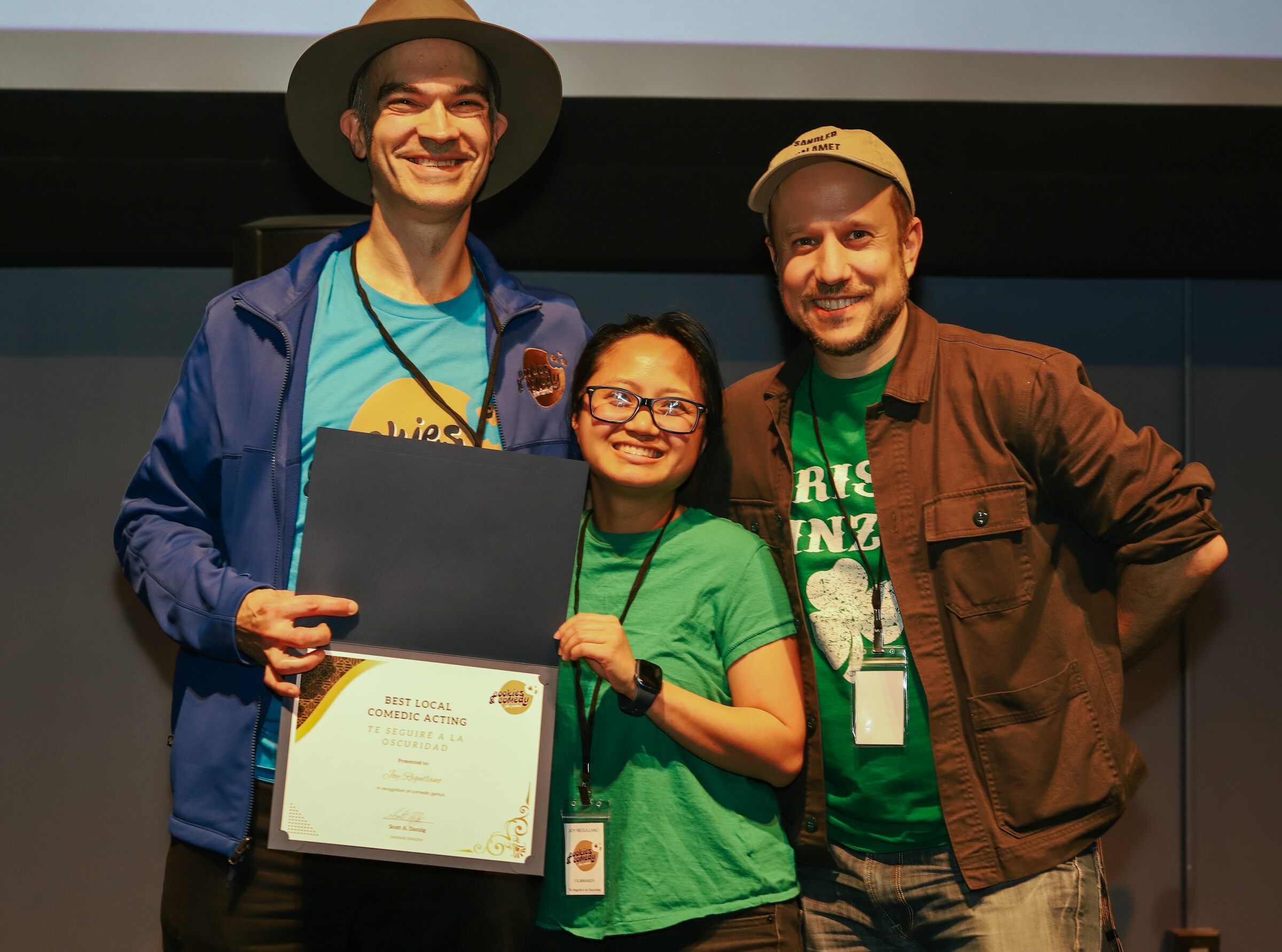 Award recipients posing with a certificate during the 2026 awards announcements