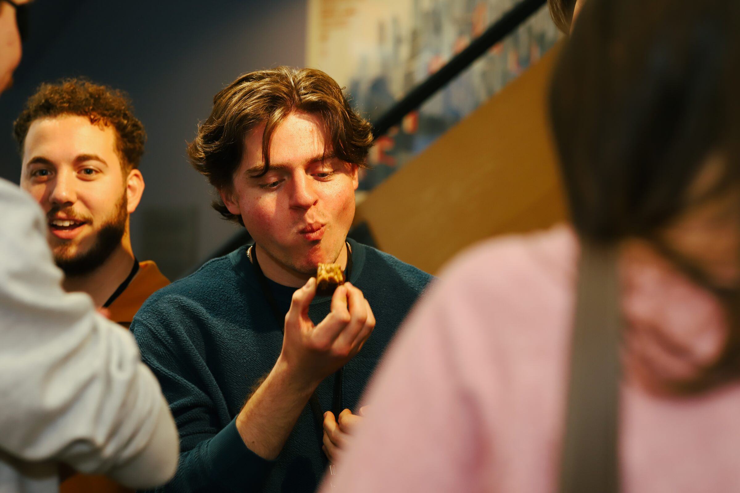 A festivalgoer savoring a cookie during the 2026 festival