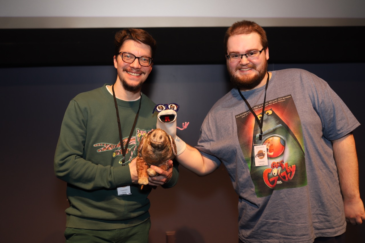 Filmmakers showing off their creations on stage