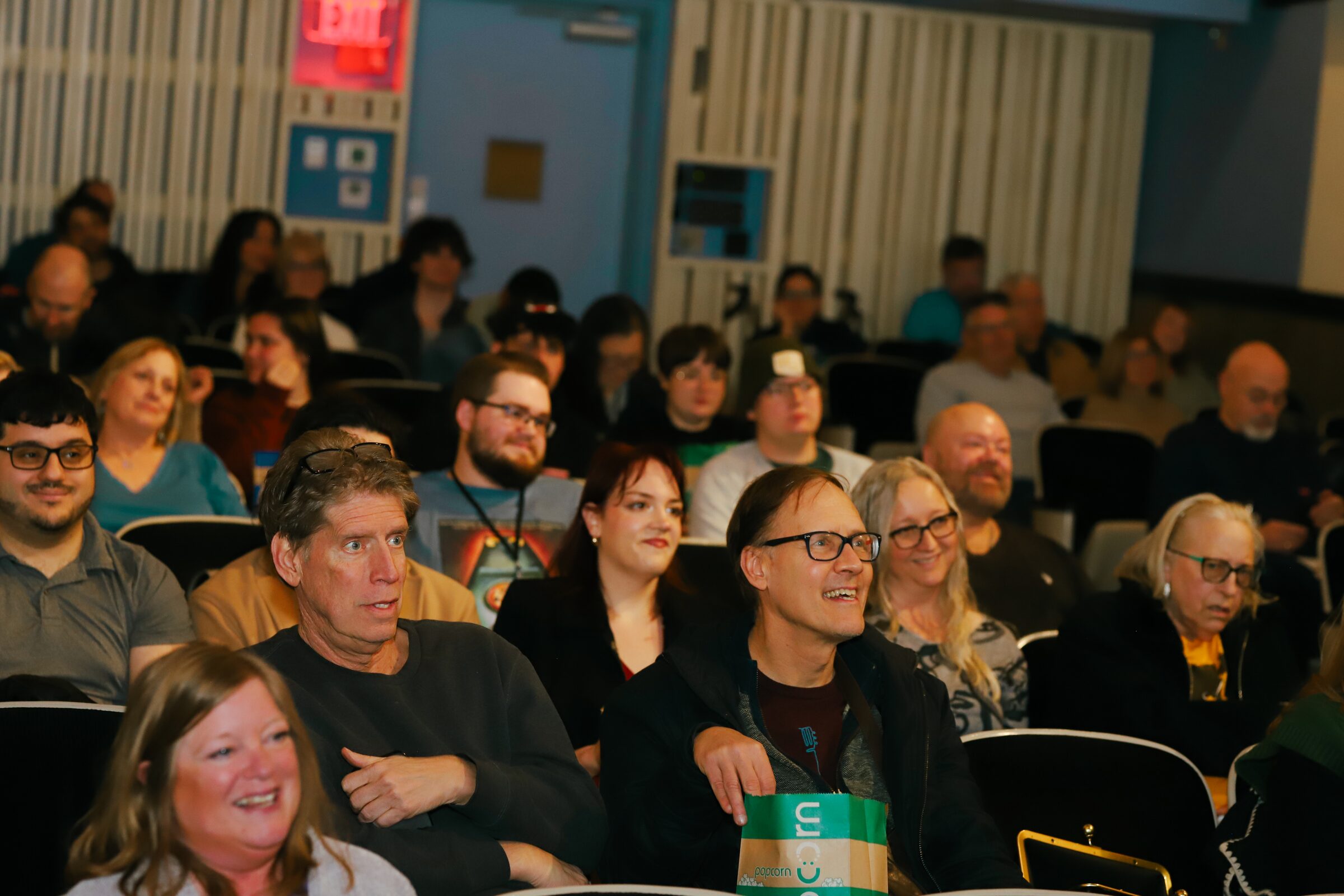 Audience members smiling and reacting during the 2026 Cookies & Comedy Film Festival